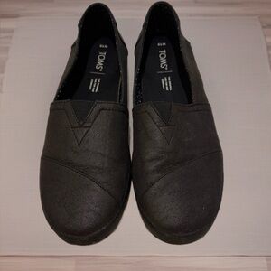 Women's black Toms slip on shoes Size 10